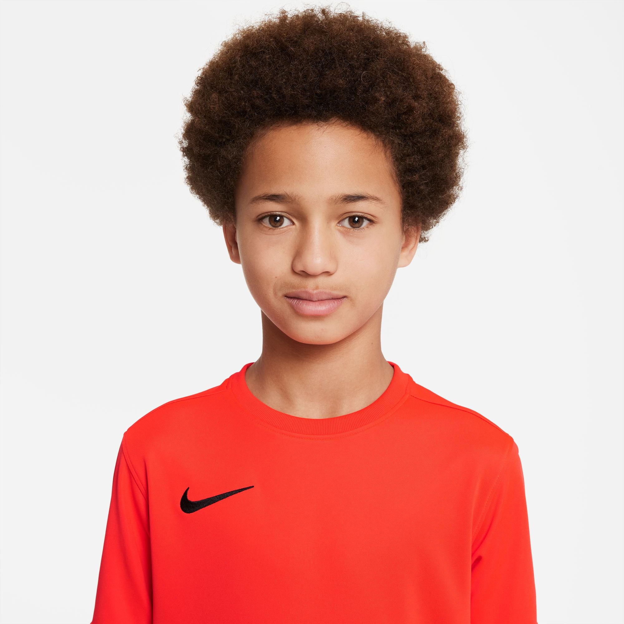 Close up of boy wearing Nike Dri-fit Park VII Shirt Short Sleeve Shirt