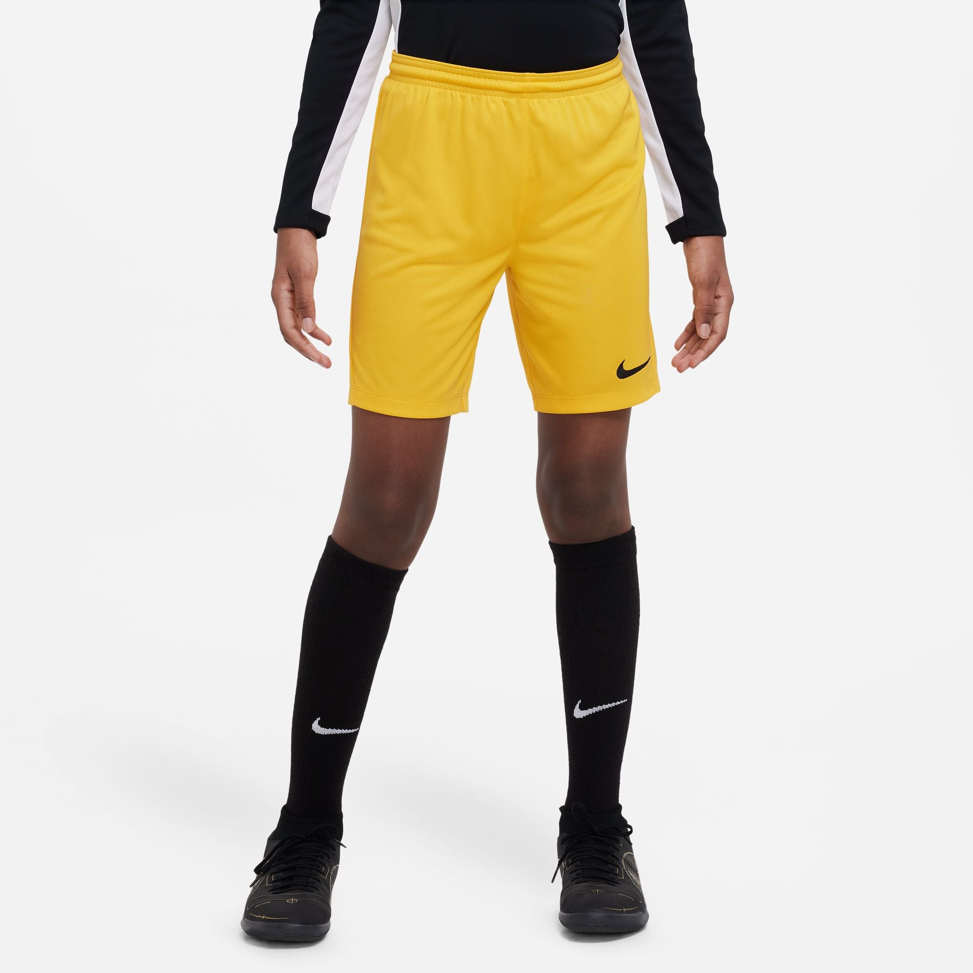 Nike Dri FIT Park III Short in University Gold/Black with black nike socks and black nike trainers