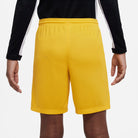 Back of Nike Dri FIT Park III Short in University Gold/Black