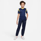 Nike Park Derby III Shirt Short Sleeve in Midnight Navy/Tour Yellow with black nike tracksuit bottoms and white nike football boots