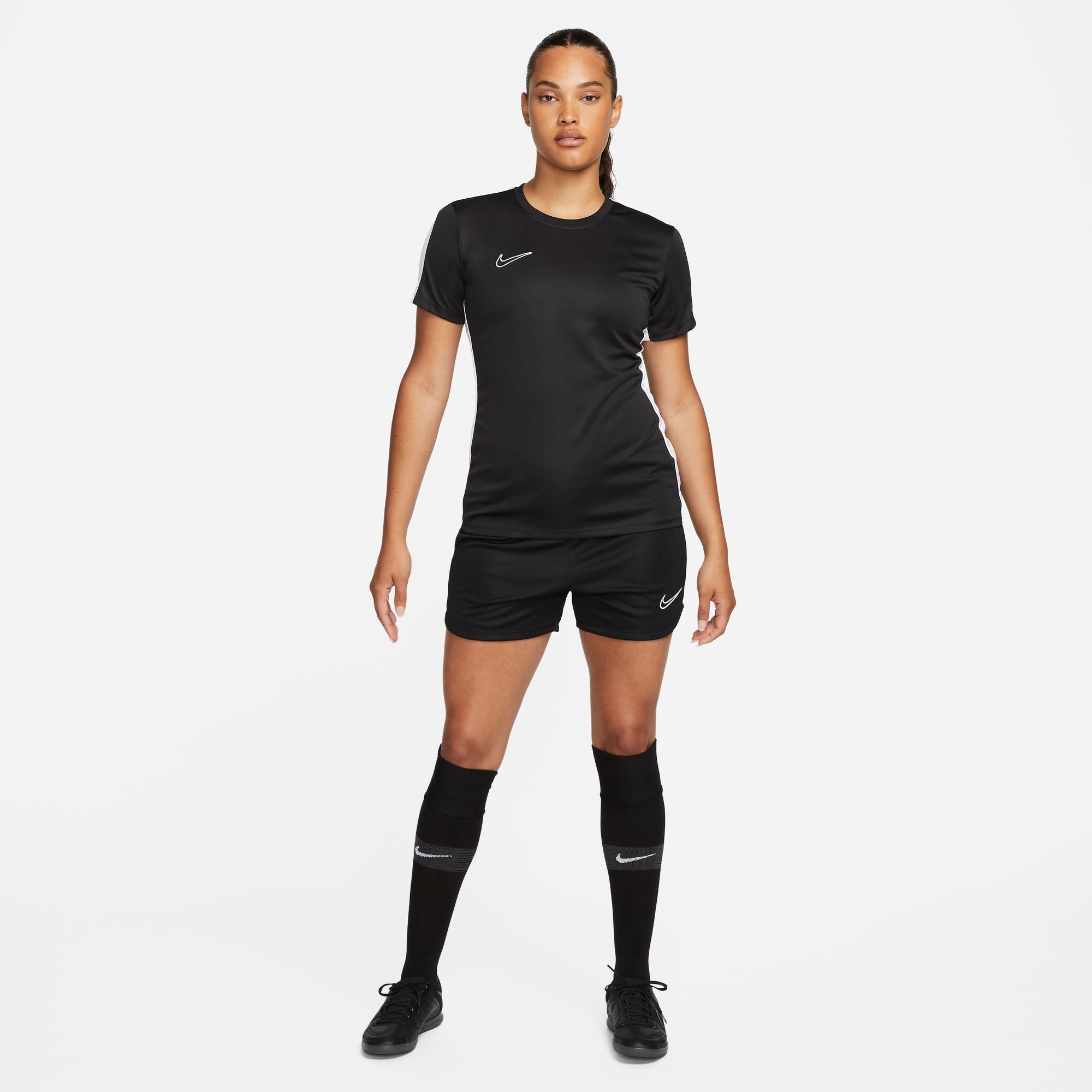 Nike Dri FIT Academy 23 Womens Short Sleeve Shirt in black with black nike shorts and black nike socks with black nike trainers