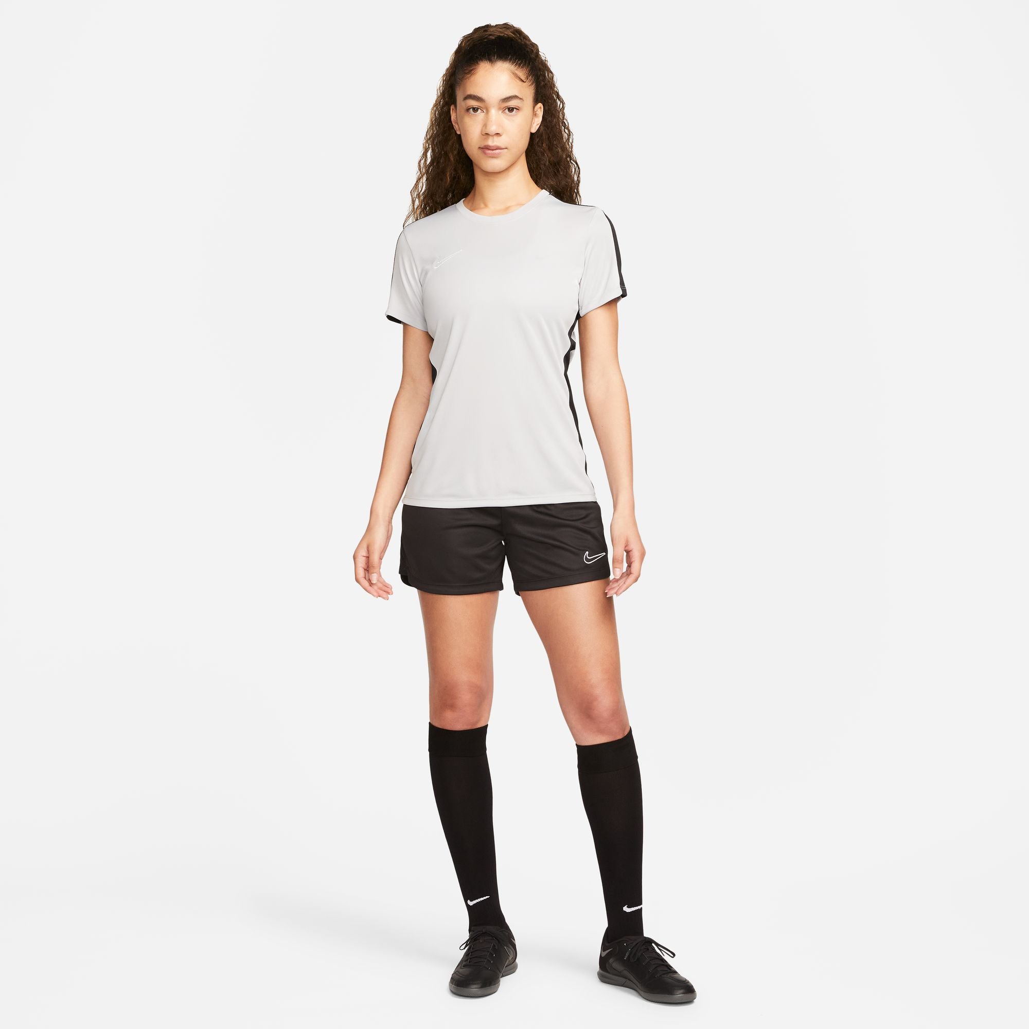 Nike Dri FIT Academy 23 Womens Short Sleeve Shirt in Wolf Grey/Black with black nike shorts and black nike socks and black nike trainers