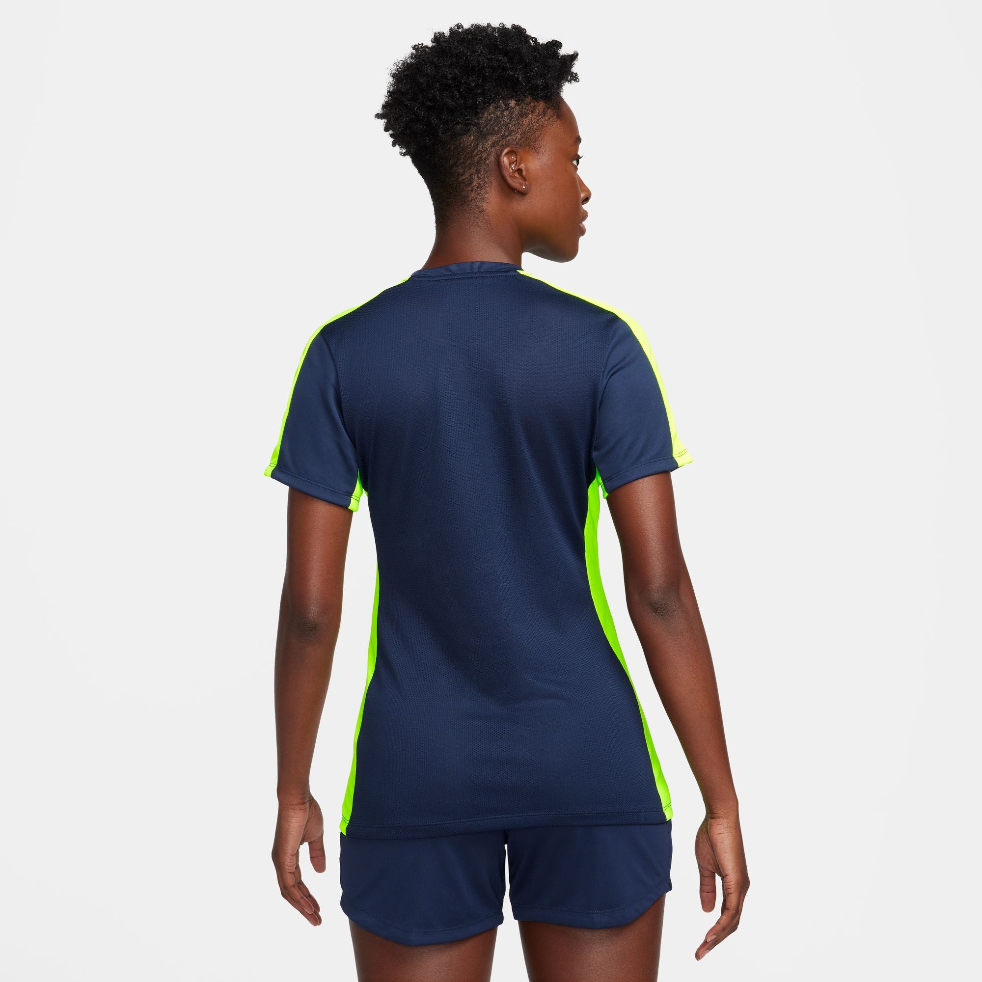 Back of Nike Dri FIT Academy 23 Womens Short Sleeve Shirt in Obsidian and Volt