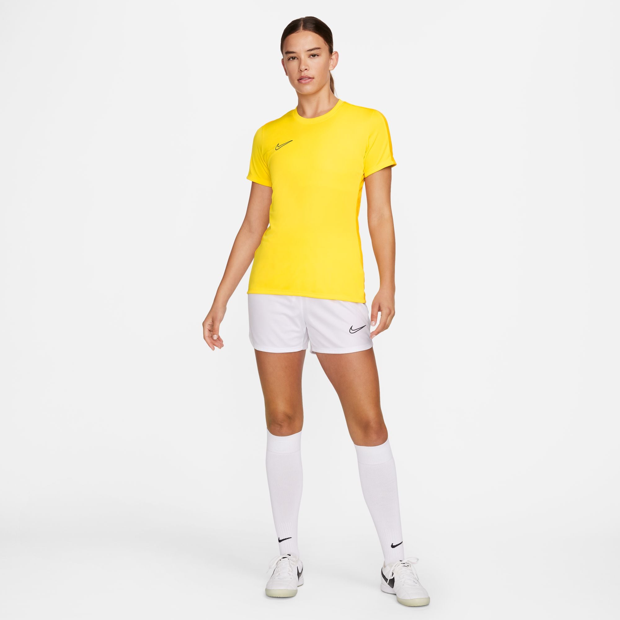 Nike Dri FIT Academy 23 Womens Short Sleeve Shirt in Tour Yellow/University Gold with white nike shorts and white nike socks and white nike trainers