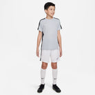 Nike Dri FIT Academy 23 Short Sleeve Shirt in Wolf Grey/Black with white nike shorts and white nike socks and black nike trainers