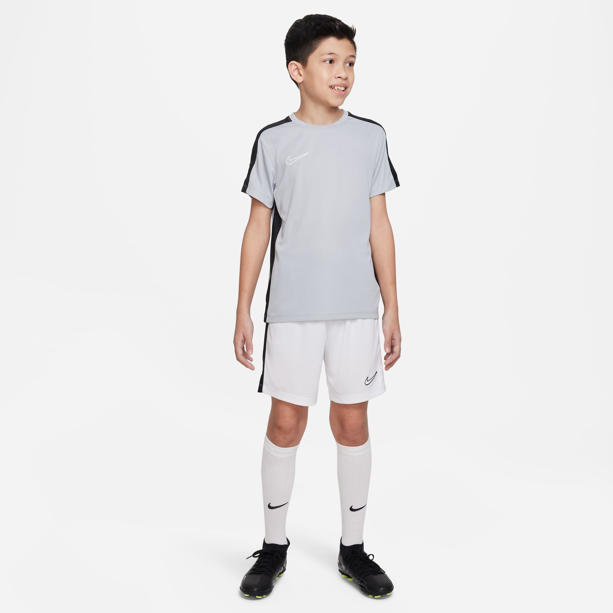 Nike Dri FIT Academy 23 Short Sleeve Shirt in Wolf Grey/Black with white nike shorts and white nike socks and black nike trainers