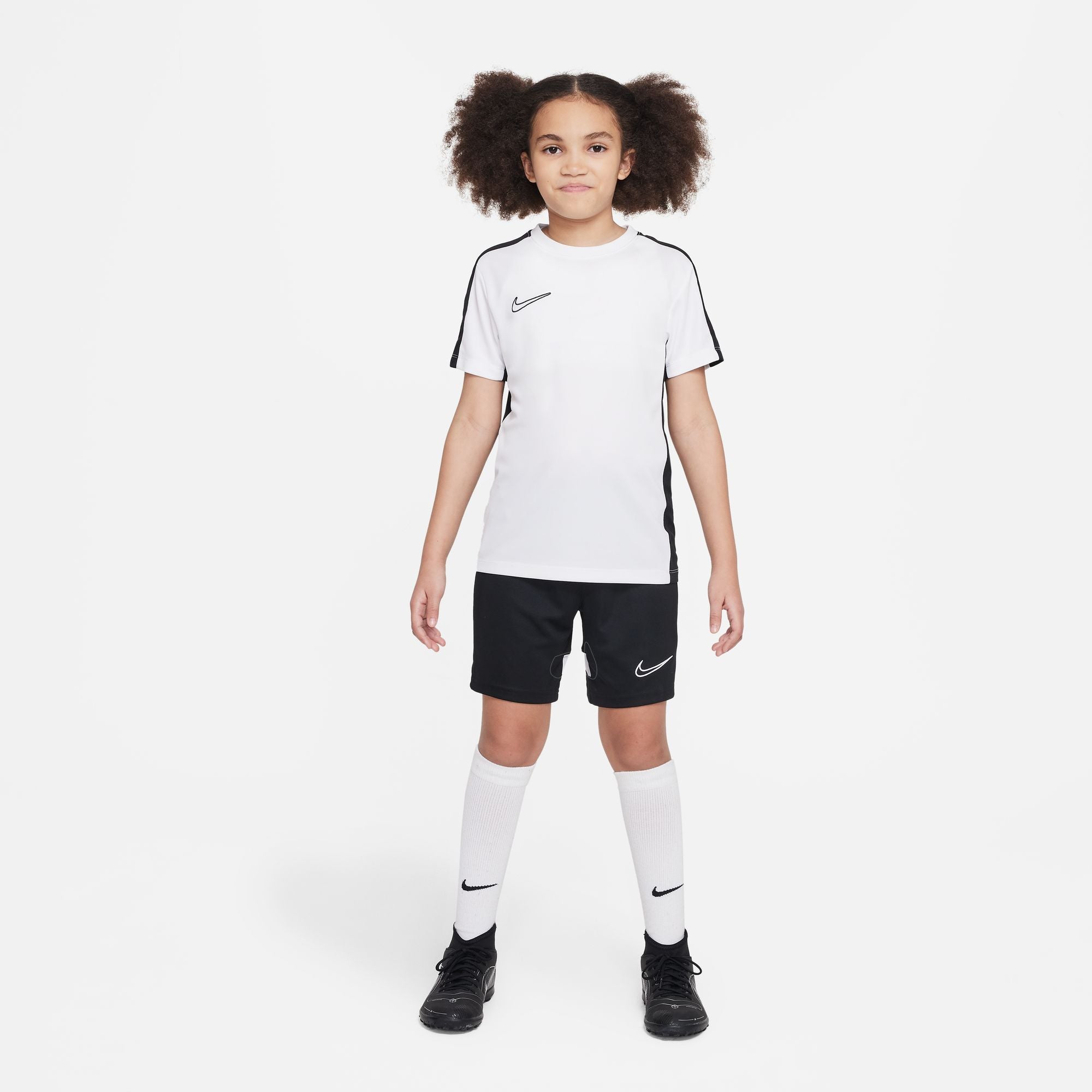 Nike Dri FIT Academy 23 Short Sleeve white and black Shirt with black nike shorts, white nike socks and black football boots