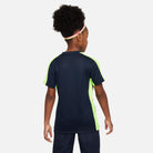 Back of Nike Dri FIT Academy 23 Short Sleeve Shirt in dark blue obsidian and nike yellow volt