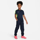 Nike Dri FIT Academy 23 Short Sleeve Shirt in obsidian and volt. Nike tracksuit bottoms in obsidian dark blue and pink nike football boots