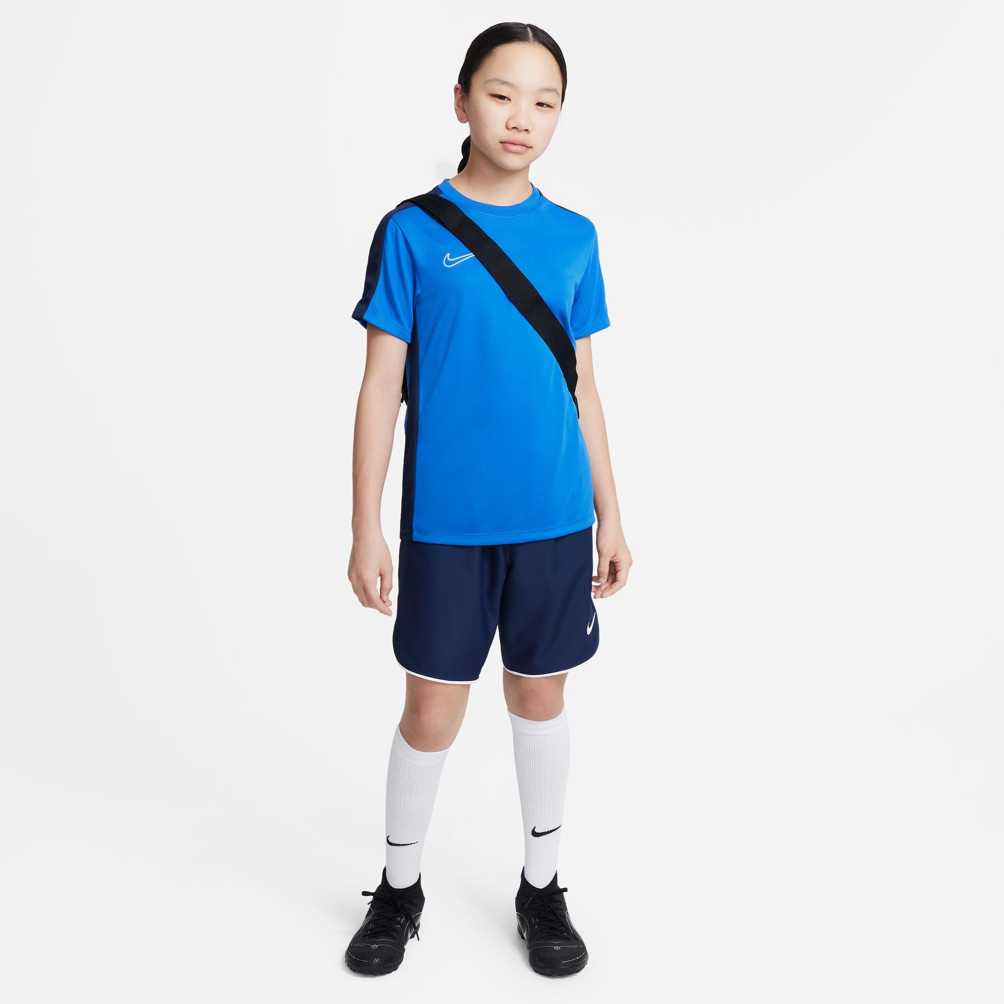 Nike Dri FIT Academy 23 Short Sleeve Royal Blue Shirt with navy nike shorts and white nike socks and black football boots