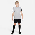 Nike Dri FIT Academy 23 Short Sleeve Polo in Wolf Grey/Black with black nike shorts and black nike socks and black nike trainers