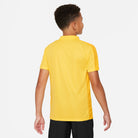 Back of Nike Dri FIT Academy 23 Short Sleeve Polo in Tour Yellow/University Gold