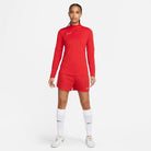 Nike Dri FIT Academy 23 1/4 Zip Women's Drill Top in University Red/Gym Red with red nike shorts and white nike trainers and white nike socks