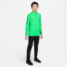 Nike Dri FIT Academy 23 1/4 Zip Green Spark/Lucky Green Drill Top with black nike tracksuit bottoms and black nike football boots