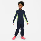 Nike Dri FIT Academy 23 1/4 Zip Obsidian and Volt Drill Top with dark blue obsidian nike tracksuit bottoms and pink nike football boots