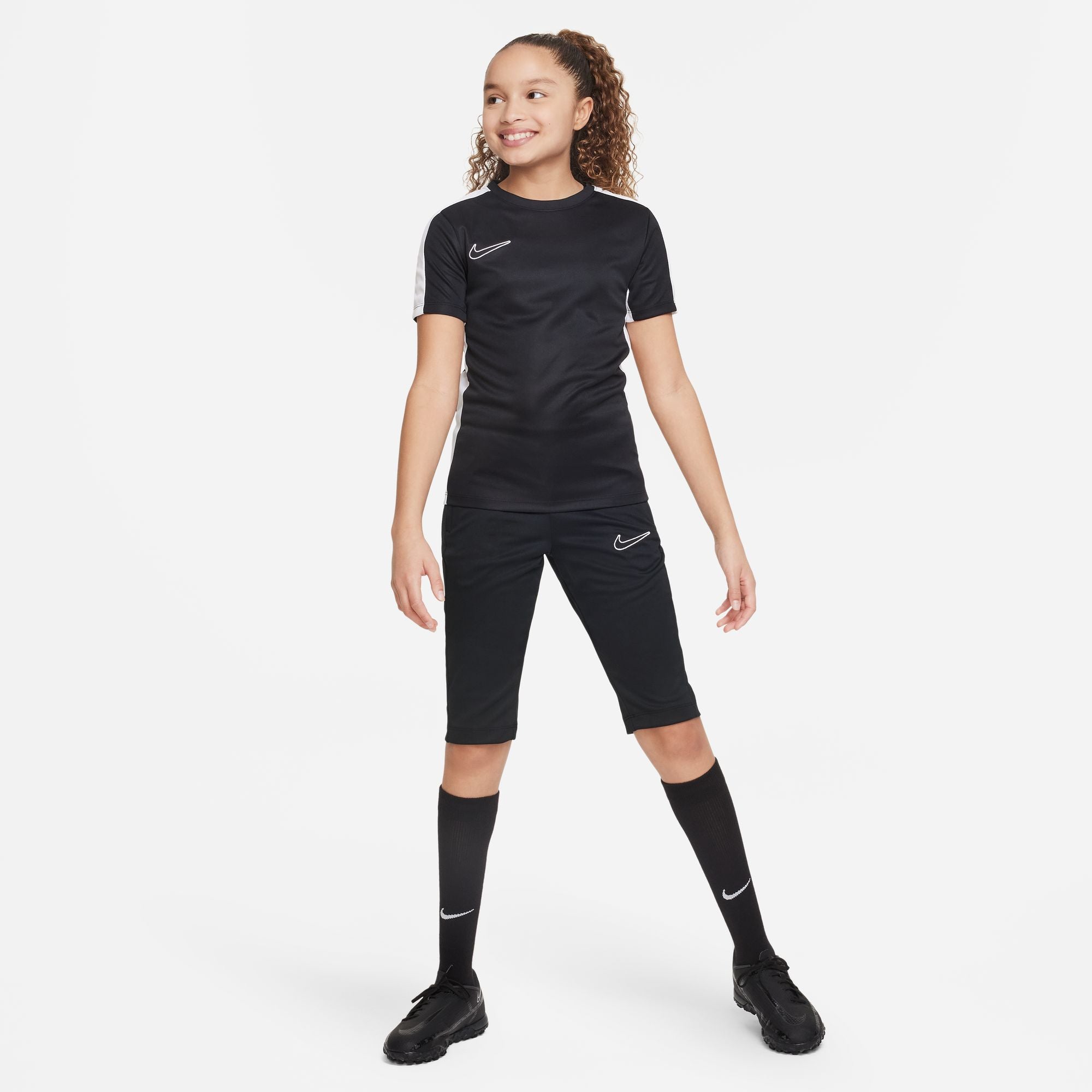 Nike Dri FIT Academy 23 3/4 Knit Pants in Black with black nike tee and black nike socks and black nike trainers