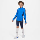 Nike Dri FIT Academy 23 3/4 Knit Pants in Obsidian with royal blue nike dri fit 1/4 zip and white nike socks and white nike trainers