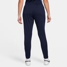 back of Nike Dri FIT Academy 23 Women's Knit Pants in obsidian dark blue