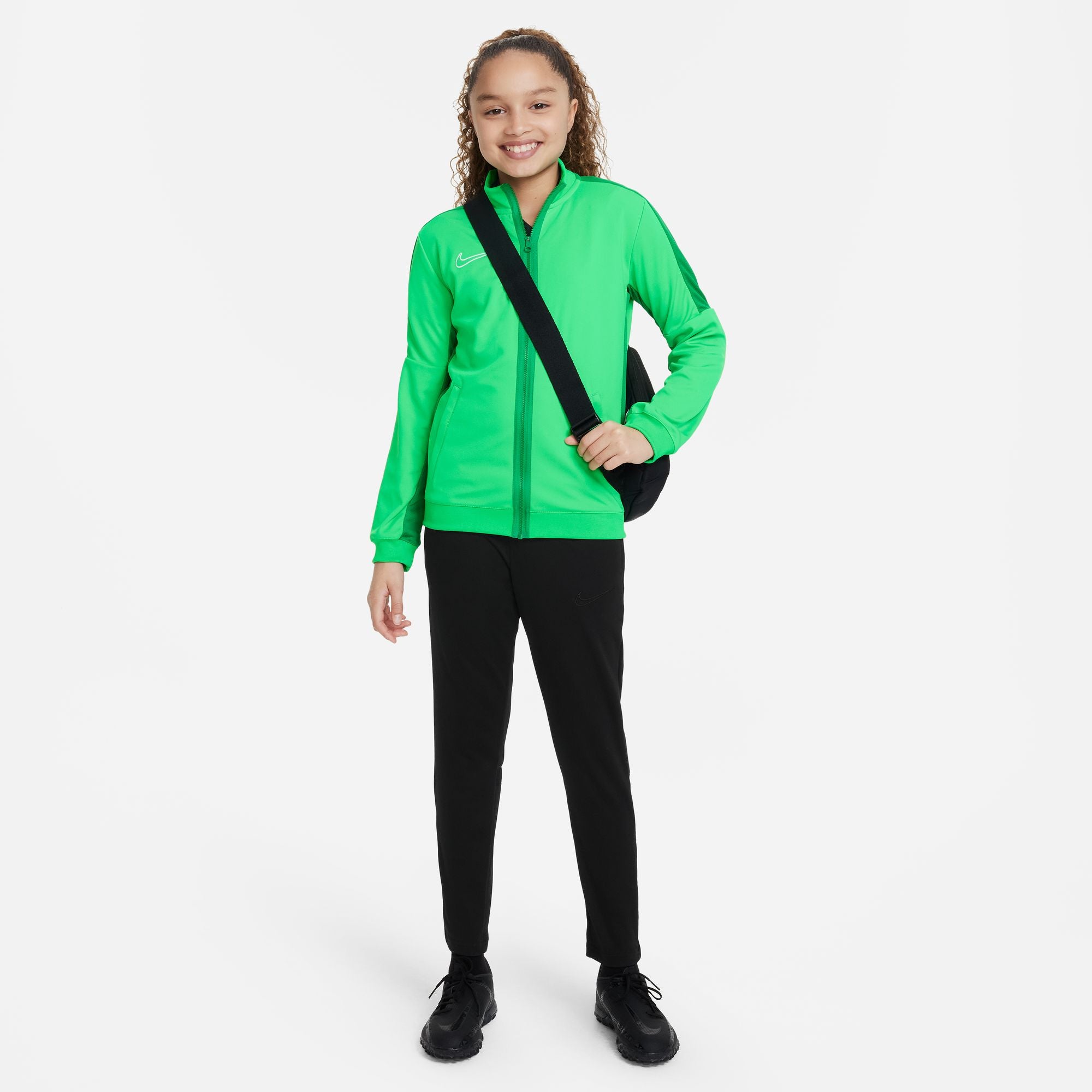 Nike Dri FIT Academy 23 Knit Track Jacket in Lucky Green/Green Spark with black nike tracksuit bottoms and black nike trainers